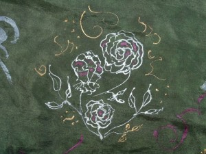 I dyed a white silk scarf green, then drew the silver rose plant and gold accents with silver and gold resist.